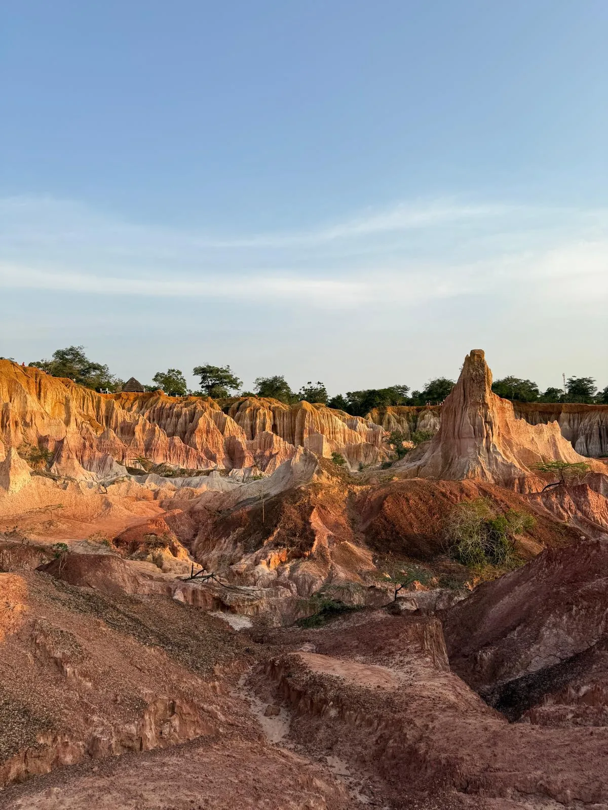 Layered canyon ridges and a tall rock pinnacle